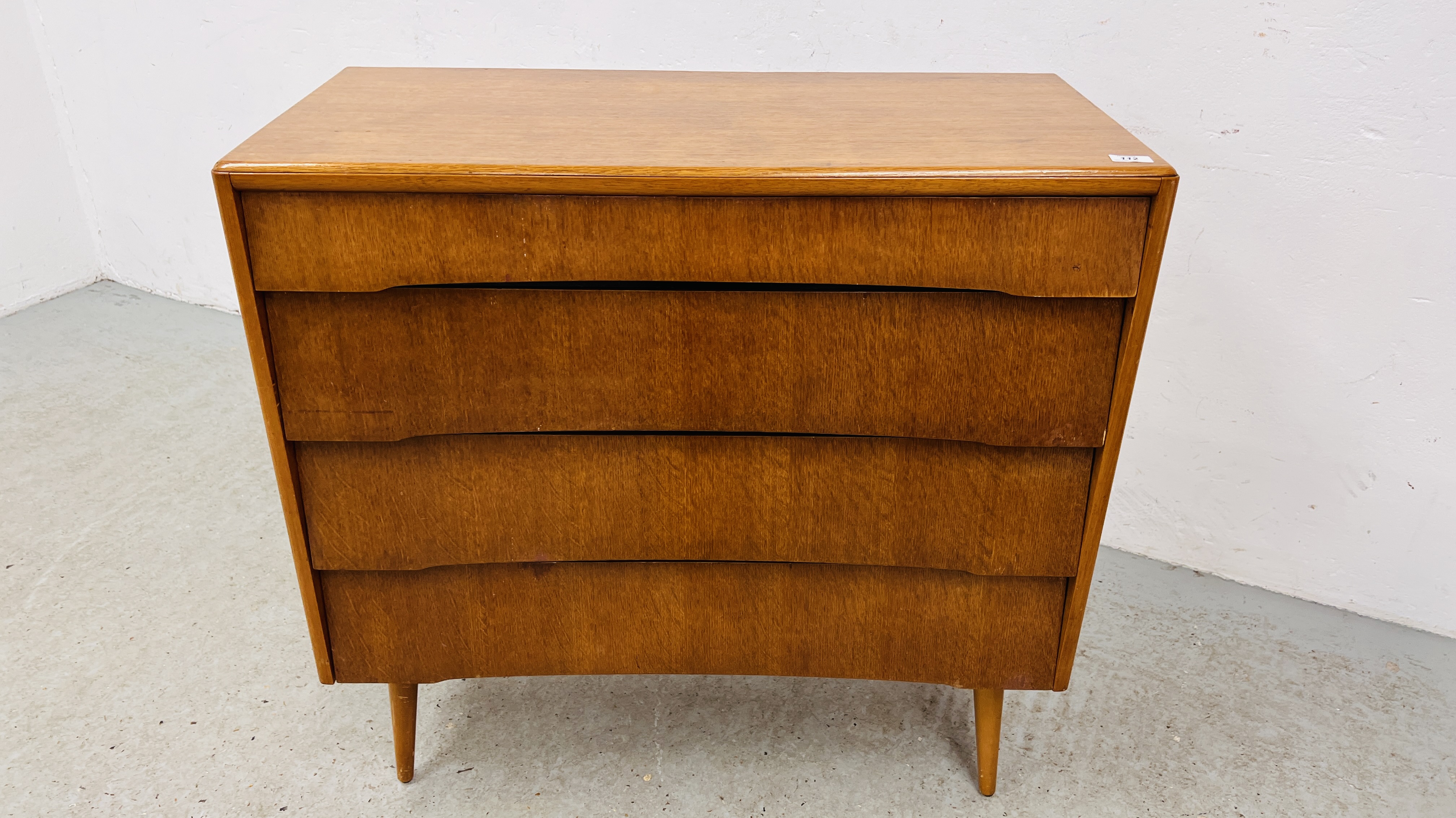 MID CENTURY TEAK FINISH FOUR DRAWER CHEST ON FOUR SUPPORTS WIDTH 91CM. DEPTH 42CM. HEIGHT 88CM.