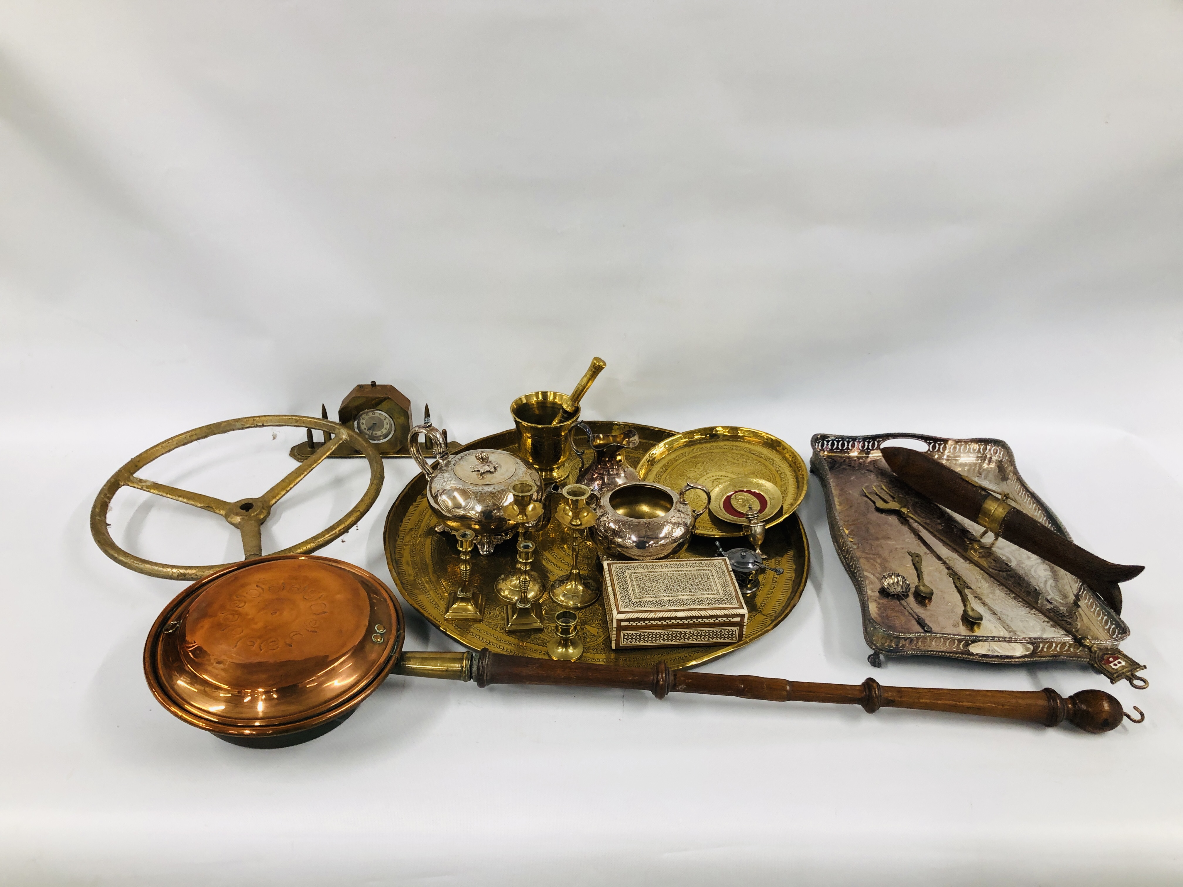 BOX OF MIXED METAL WARE TO INCLUDE A TRENCH ART CLOCK, THREE PIECE SILVER PLATED TEASET AND TRAY,