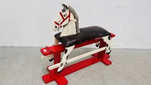 A VINTAGE CHILDS ROCKING HORSE WITH BROWN LEATHER SADDLE
