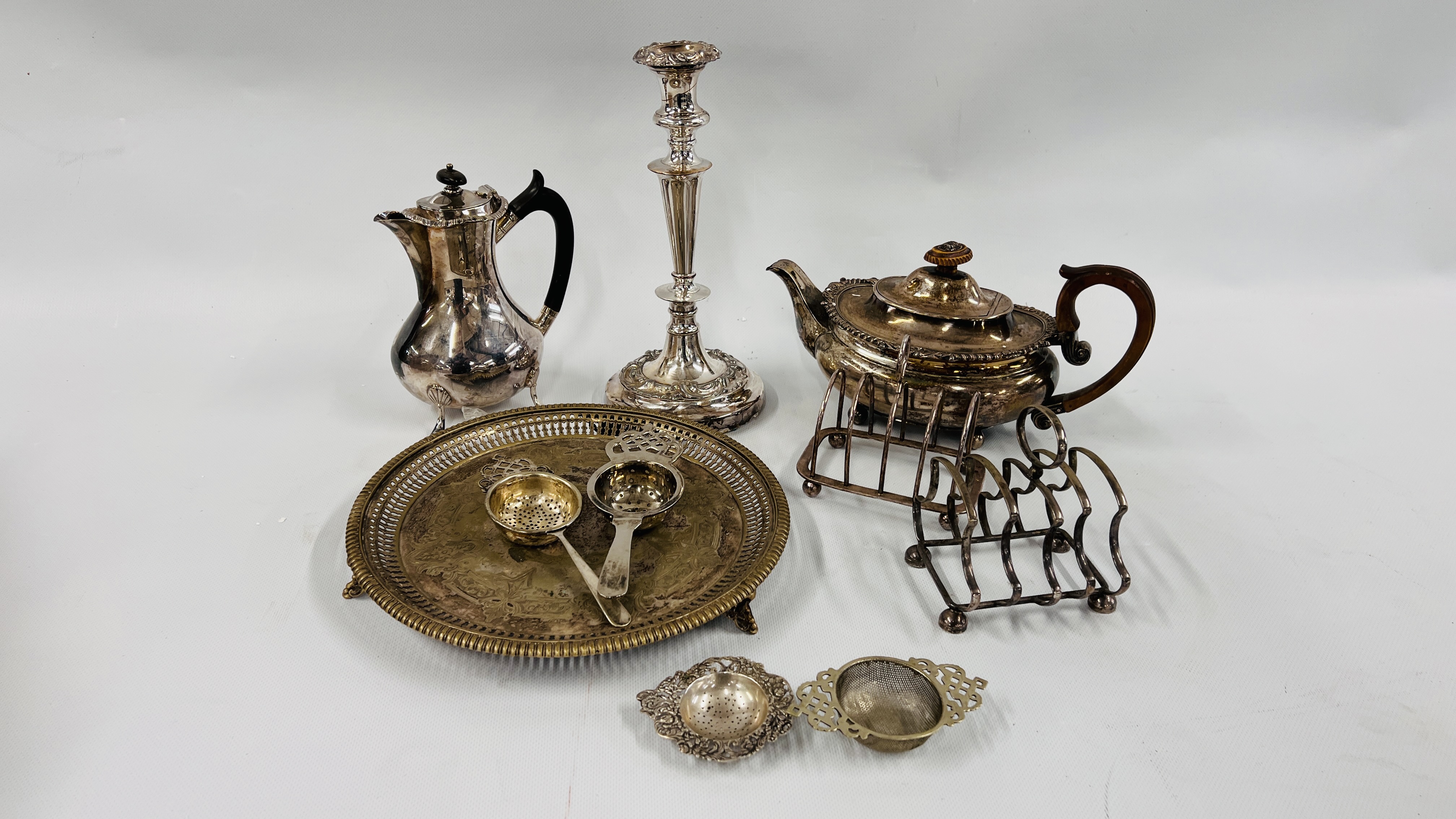BOX OF ASSORTED PLATED WARE TO INCLUDE TOAST RACKS, SALVER AND A CANDLESTICK, TEA AND COFFEE POTS,