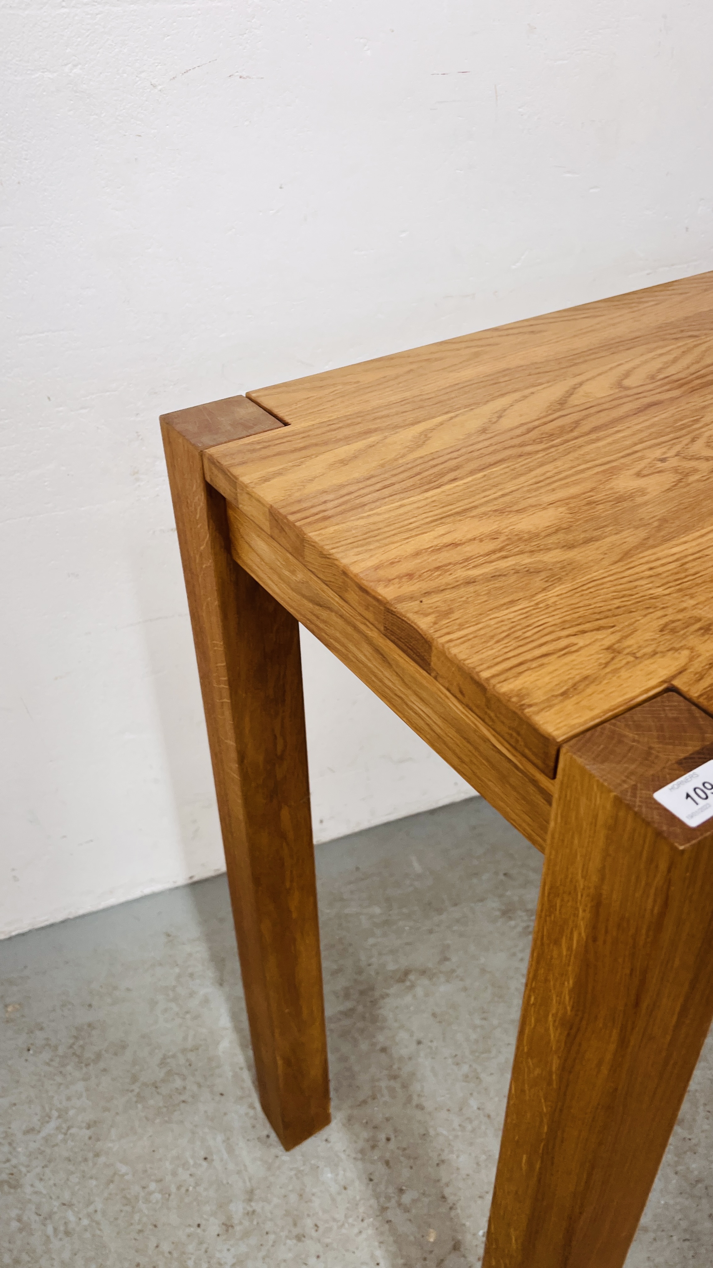 A HEAVY OAK RECTANGULAR BREAKFAST BAR/BAR TABLE ON FOUR SQUARE SUPPORTS WIDTH 120CM. DEPTH 50CM. - Image 8 of 12