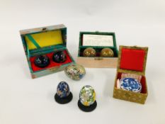 TWO CASED SETS OF CHINESE HEALTHY BALLS ALONG WITH THREE ENAMELLED EGGS ALONG WITH TWO CIRCULAR