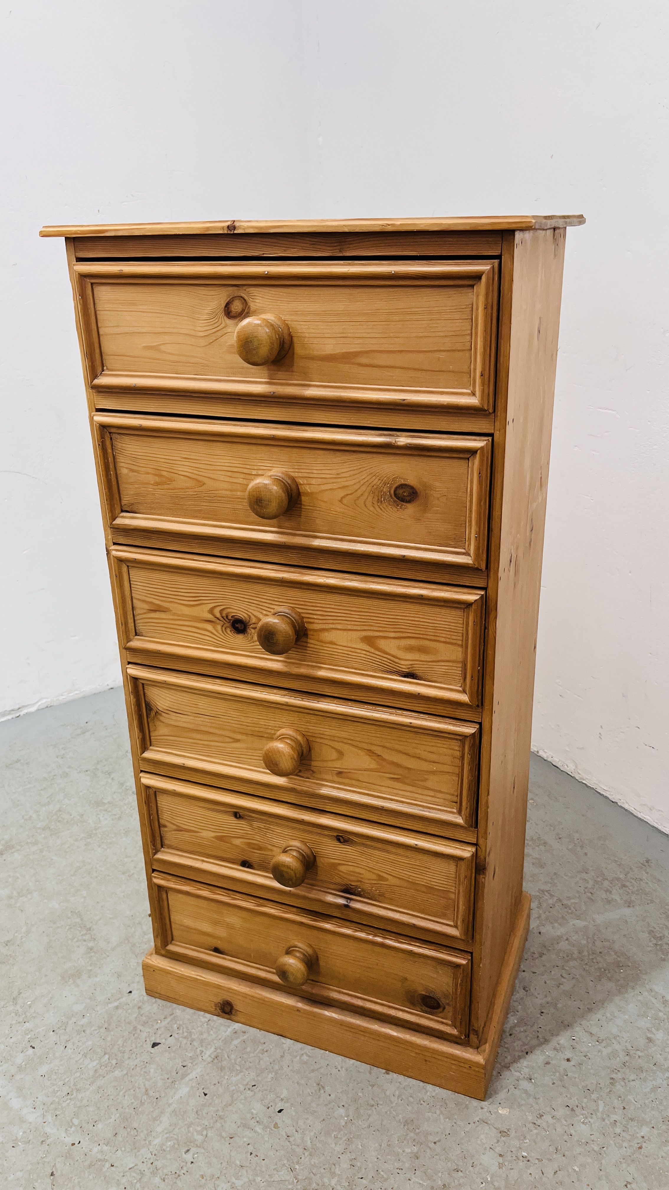 WAXED PINE SIX DRAWER TOWER CHEST HEIGHT 106CM. WIDTH 52CM. DEPTH 32CM.