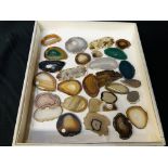 A COLLECTION OF APPROX 28 POLISHED AGATE SLICES.