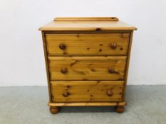 A SMALL SOLID HONEY PINE THREE DRAWER CHEST WIDTH 67CM. DEPTH 46CM. HEIGHT 78CM.