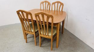 AN EXTENDING BEECHWOOD FINISH DINING SET COMPRISING TABLE AND FOUR CHAIRS,