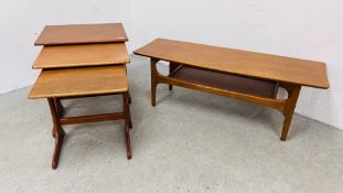 MID-CENTURY TEAK FINISH COFFEE TABLE ALONG WITH A NEST OF THREE MID-CENTURY TEAK FINISH COFFEE