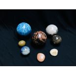 A COLLECTION OF 4 HARD STONE POLISHED SPHERES TO INCLUDE FLUORITE + ONE OTHER ALONG WITH 3 POLISHED