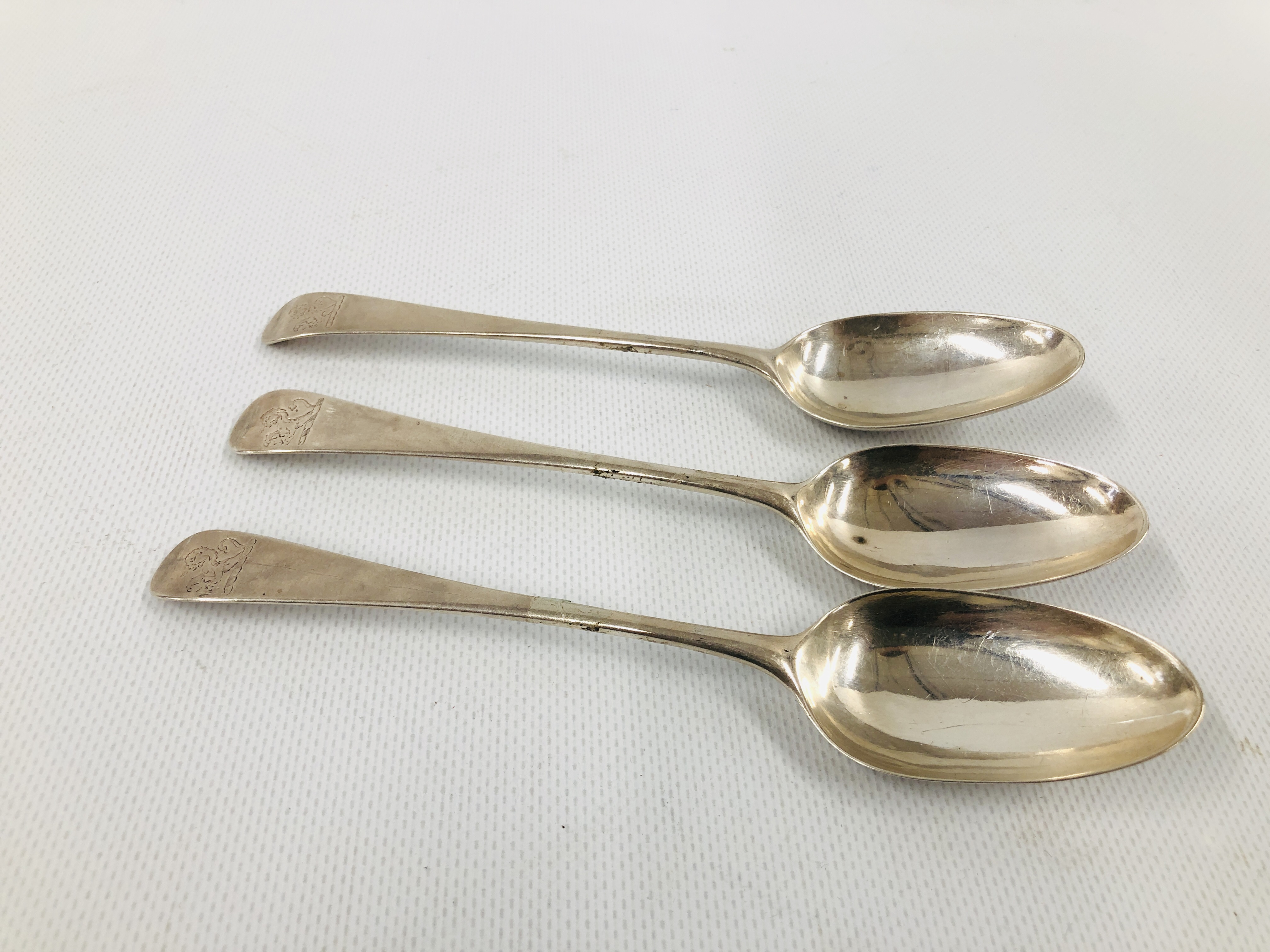 THREE GEORGE II SILVER OLD ENGLISH PATTERN DESSERT SPOONS, PROBABLY LONDON 1759.