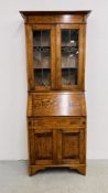 AN OAK ARTS AND CRAFTS STYLE BUREAU BOOKCASE WITH GLAZED STAINGLASS DOORS