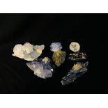 A COLLECTION OF APPROX 7 CRYSTAL AND MINERAL ROCK EXAMPLES TO INCLUDE QUARTZ, CELESTINE ETC.