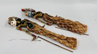 PAIR OF INDONESIAN CARVED WOODEN STICK PUPPET DOLLS IN TRADITIONAL DRESS LENGTH 74CM.
