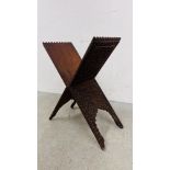 AN ANTIQUE HEAVILY CARVED HARDWOOD FOLDING CROSS DESIGN STAND