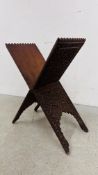 AN ANTIQUE HEAVILY CARVED HARDWOOD FOLDING CROSS DESIGN STAND