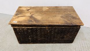 AN ANTIQUE PINE BLANKET CHEST WITH HAND CARVED FRONT PANEL WIDTH 85CM. DEPTH 43CM. HEIGHT 42CM.