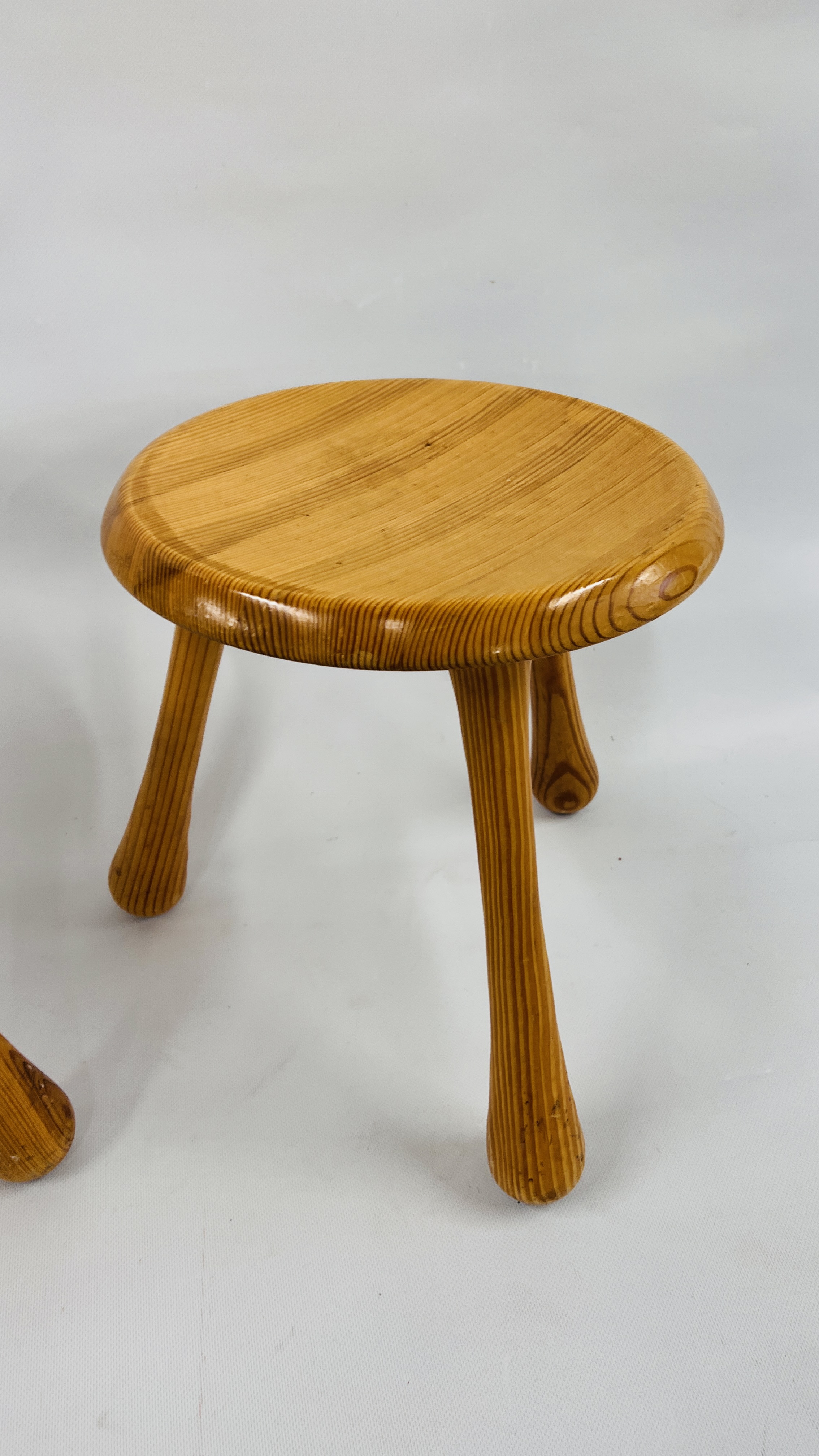 PAIR OF HONEY PINE LOW STOOLS ON TRIPOD LEGS BEARING IMPRESSED MAKERS MARK "INGVAR KAMPRAD" - Image 2 of 6