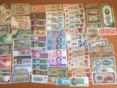 A PACKET OF BANKNOTES IN MIXED GRADES, IRAN, CAMBODIA, THAILAND, CHINA ETC (APPROX 85).