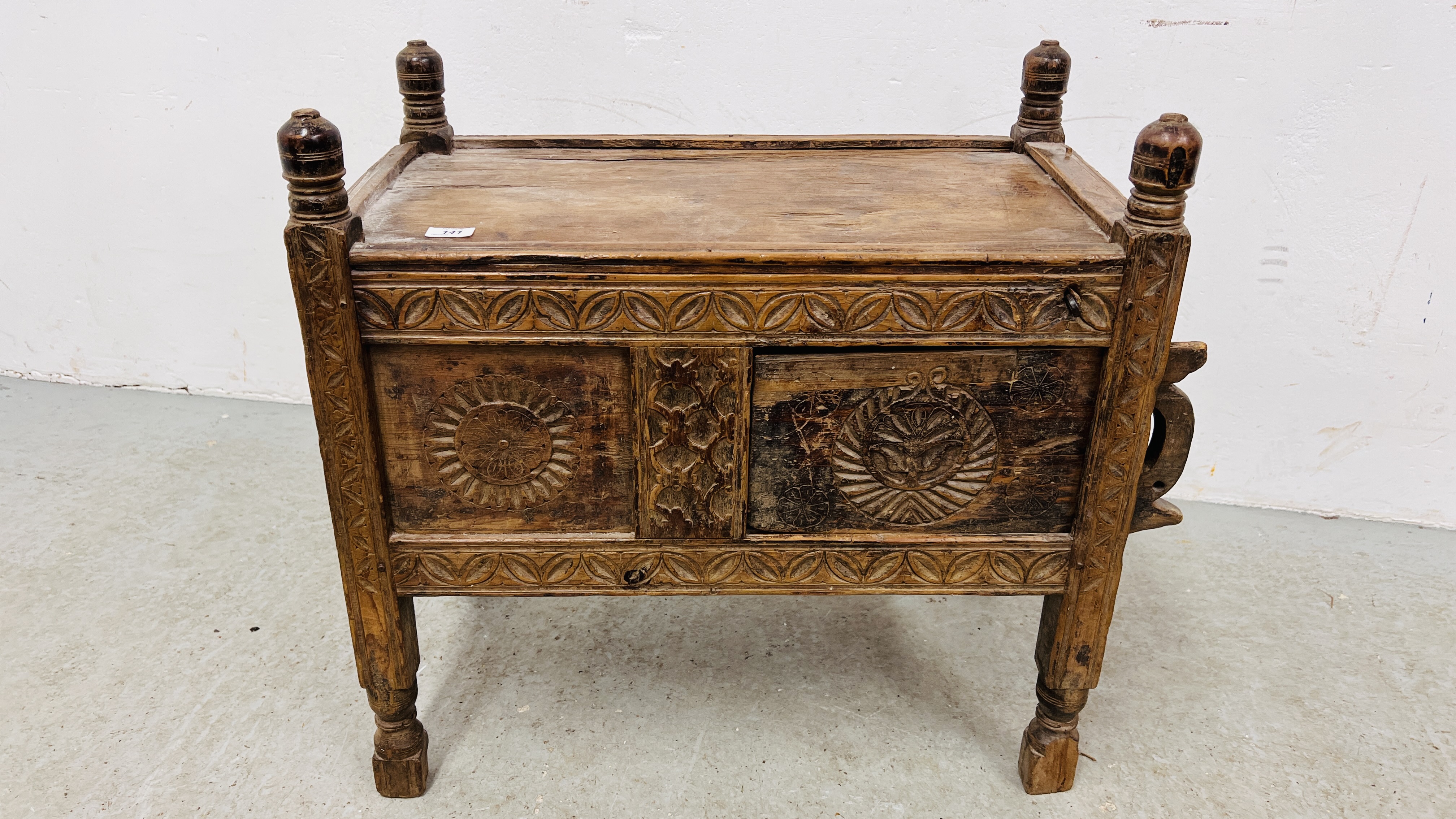 AN EASTERN HAND CARVED C19TH. DOWRY CHEST/CUPBOARD, WIDTH 71CM. DEPTH 40CM. HEIGHT 68CM.