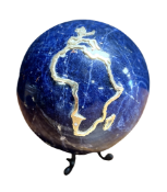 A LARGE LAPIS LAZULI SPHERE DEPICTING AN APPLIED COUNTRY OUTLINED IN 18CT GOLD SET WITH TWO