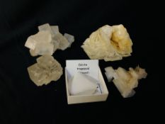 A COLLECTION OF APPROX 5 CRYSTAL AND MINERAL ROCK EXAMPLES TO INCLUDE QUARTZ, CALCITE TRAPEZOID ETC.