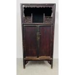 A RUSTIC CHINESE CABINET THE TWO PANELLED DOORS CONCEALING TWO INTERNAL DRAWERS WITH OPEN GALLERIED