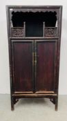 A RUSTIC CHINESE CABINET THE TWO PANELLED DOORS CONCEALING TWO INTERNAL DRAWERS WITH OPEN GALLERIED