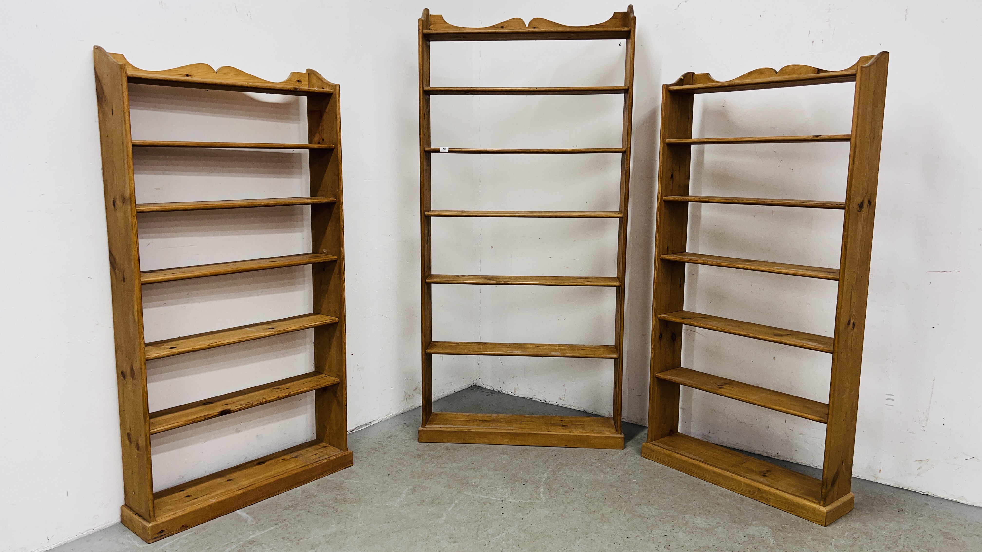 THREE WAXED PINE OPEN BOOK SHELVES TO INCLUDE 1 X SEVEN TIER WIDTH 88CM. HEIGHT 176CM.