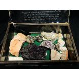 A COLLECTION OF CRYSTAL AND MINERAL ROCK EXAMPLES IN A DISPLAY CASE INSCRIBED "THE OPAL" FOR IN