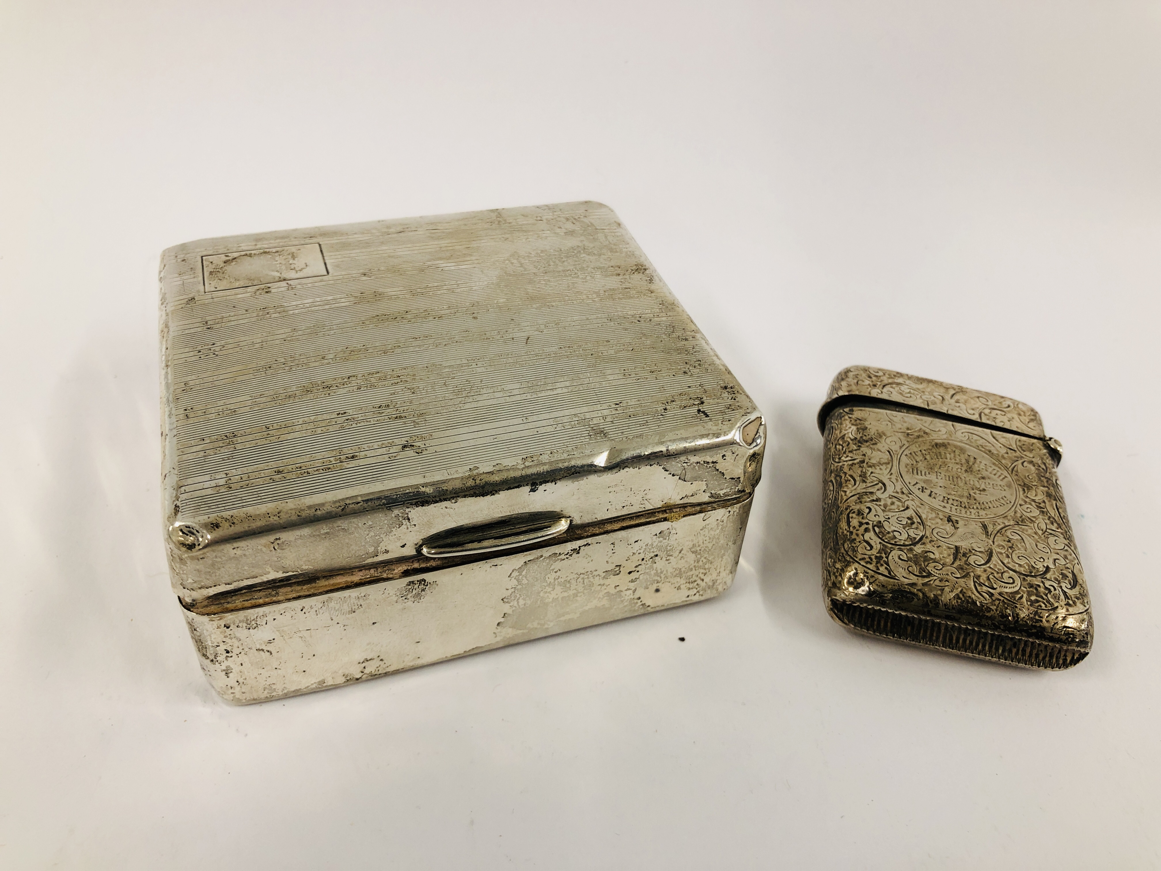 SILVER CIGARETTE BOX (A/F RUBBED MARKS) ALONG WITH A SILVER VESTA CASE,