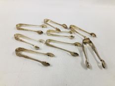 GROUP OF 8 VARIOUS SILVER SUGAR NIPS, VARIOUS MAKERS AND ASSAYS.