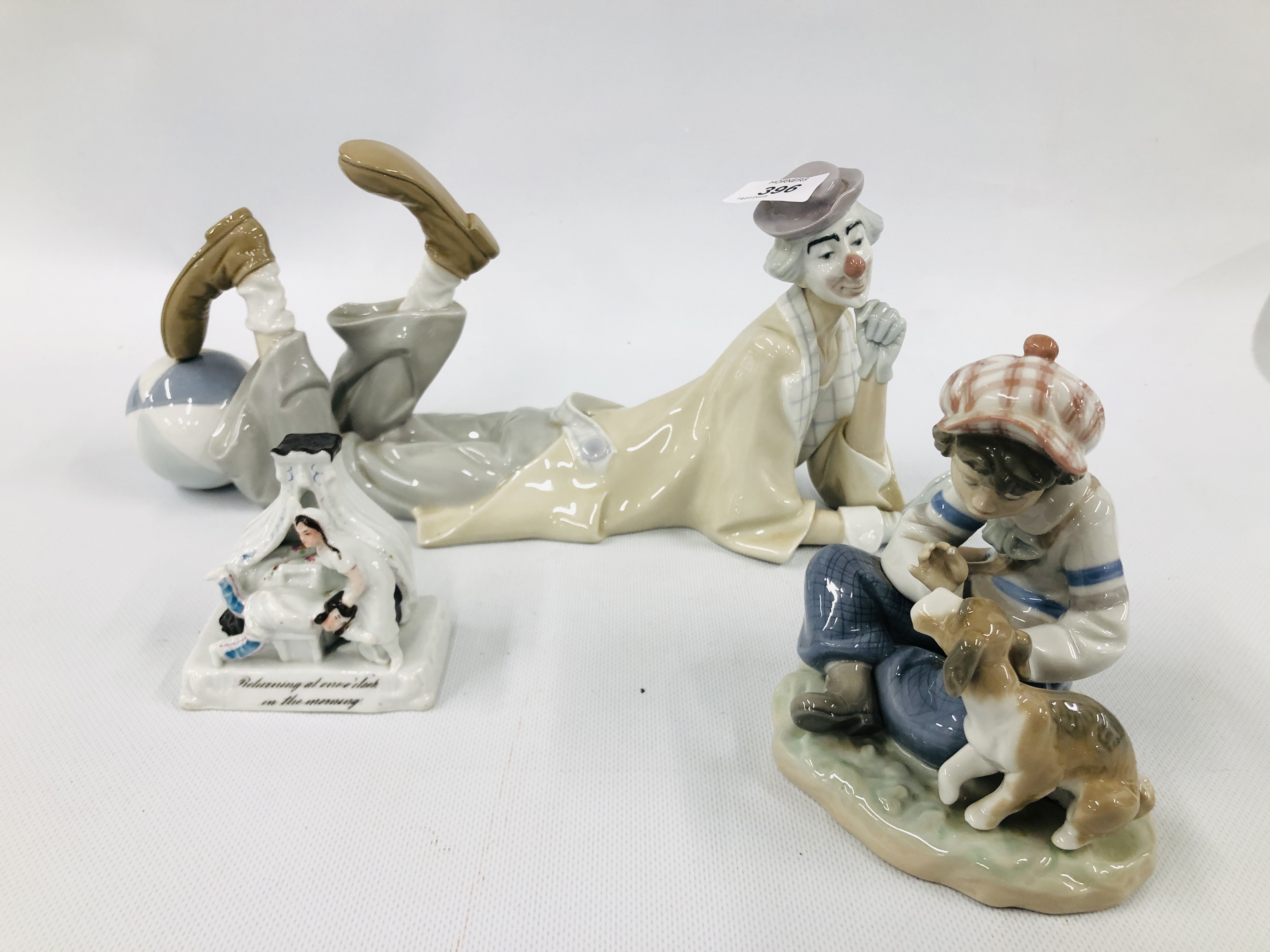 LLADRO CLOWN FIGURE IN LAYING POSE MY-22 H LENGTH 37CM AND LLADRO SEATED BOY WITH PUPPY A/F