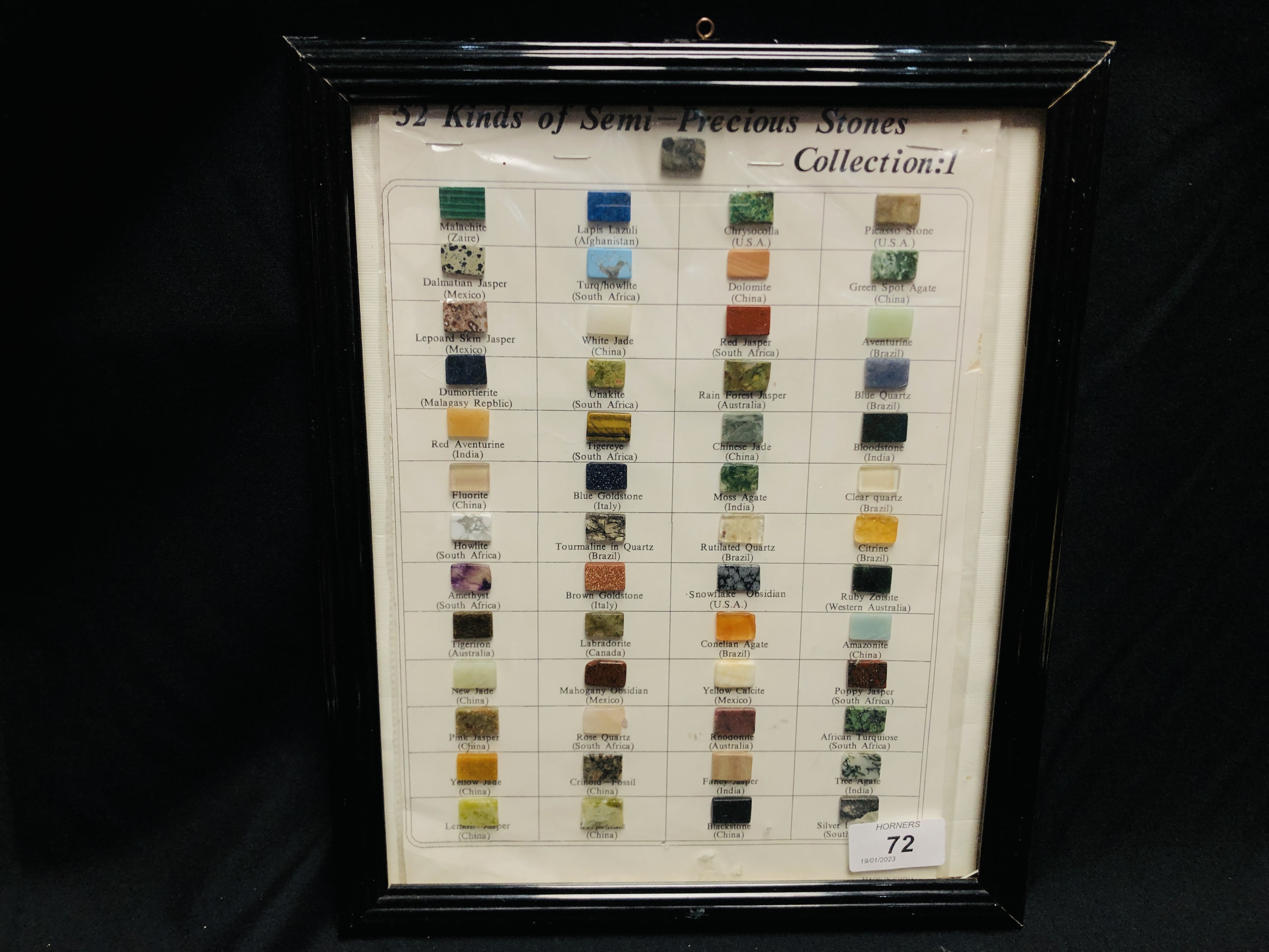 FRAMED DISPLAY OF 52 KINDS OF SEMI-PRECIOUS STONES.