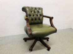 A GREEN LEATHER UPHOLSTERED OFFICE CHAIR WITH STUD DETAIL