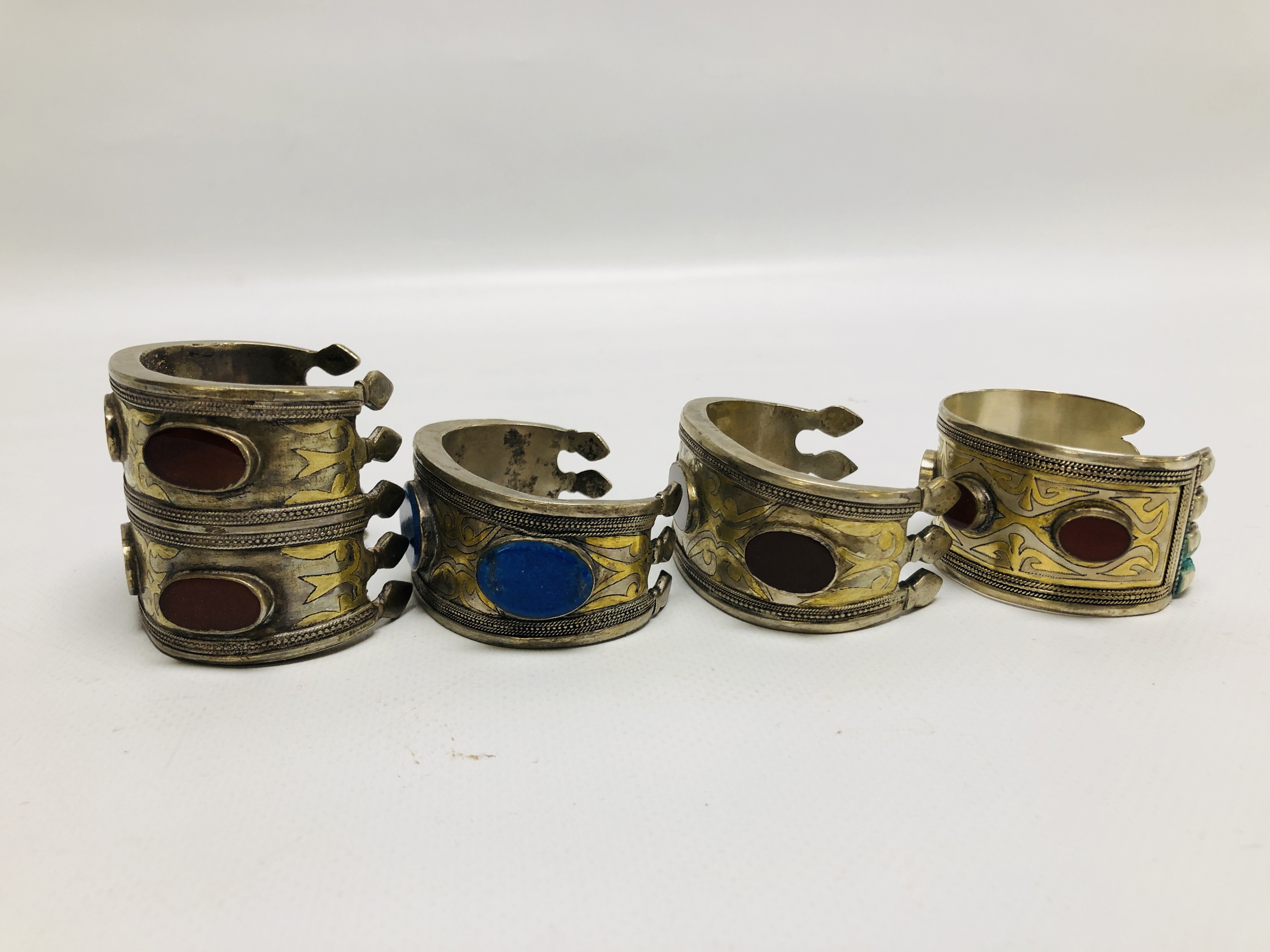 A GROUP OF 4 EASTERN STYLE WHITE METAL CUFF BRACELETS, INSET WITH OVAL STONES. - Image 8 of 8