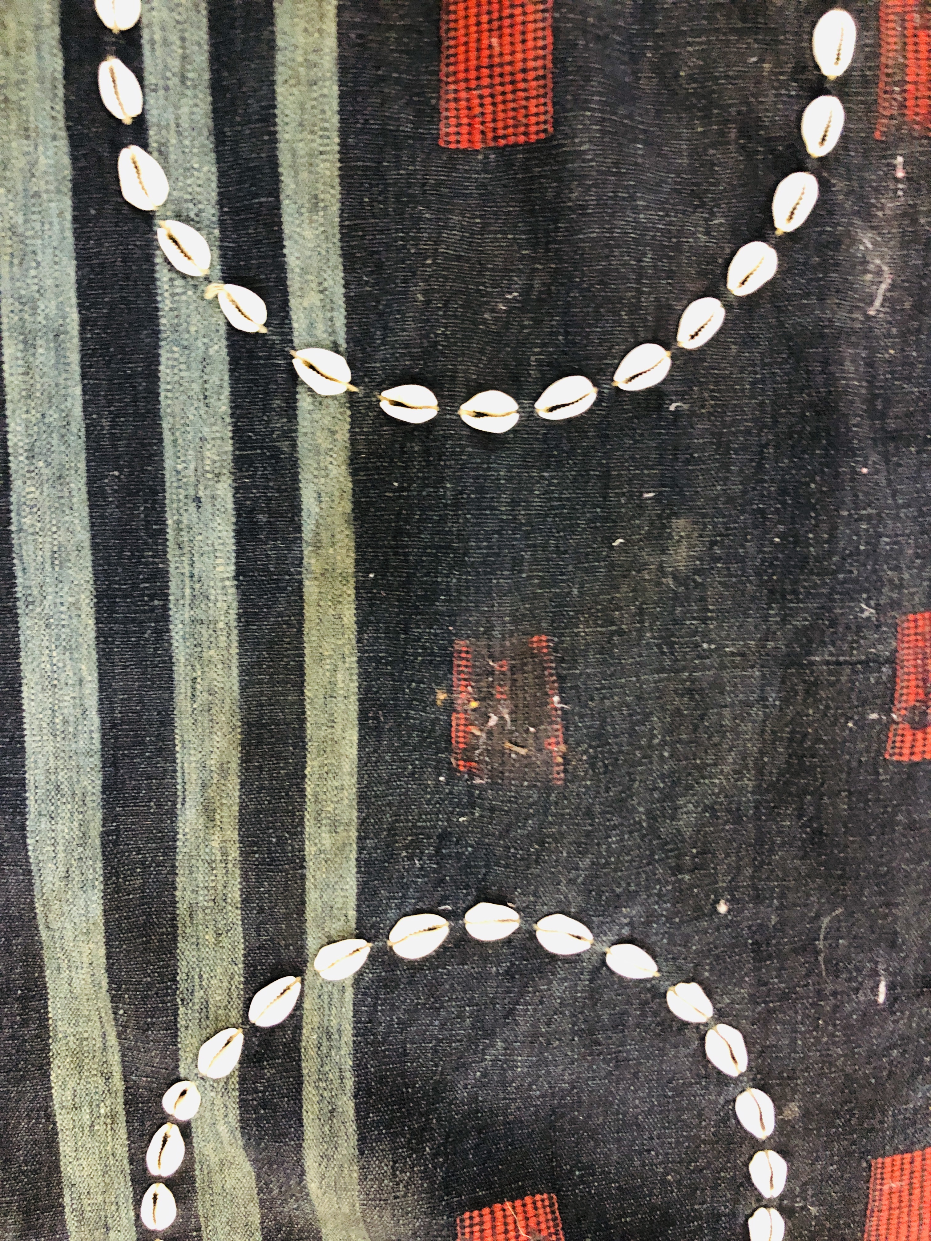 A GROUP OF ETHNIC TRIBAL TEXTILES TO INCLUDE A CLOTH / COVER DECORATED WITH "COWRIE" SHELL APPLIED - Image 3 of 15