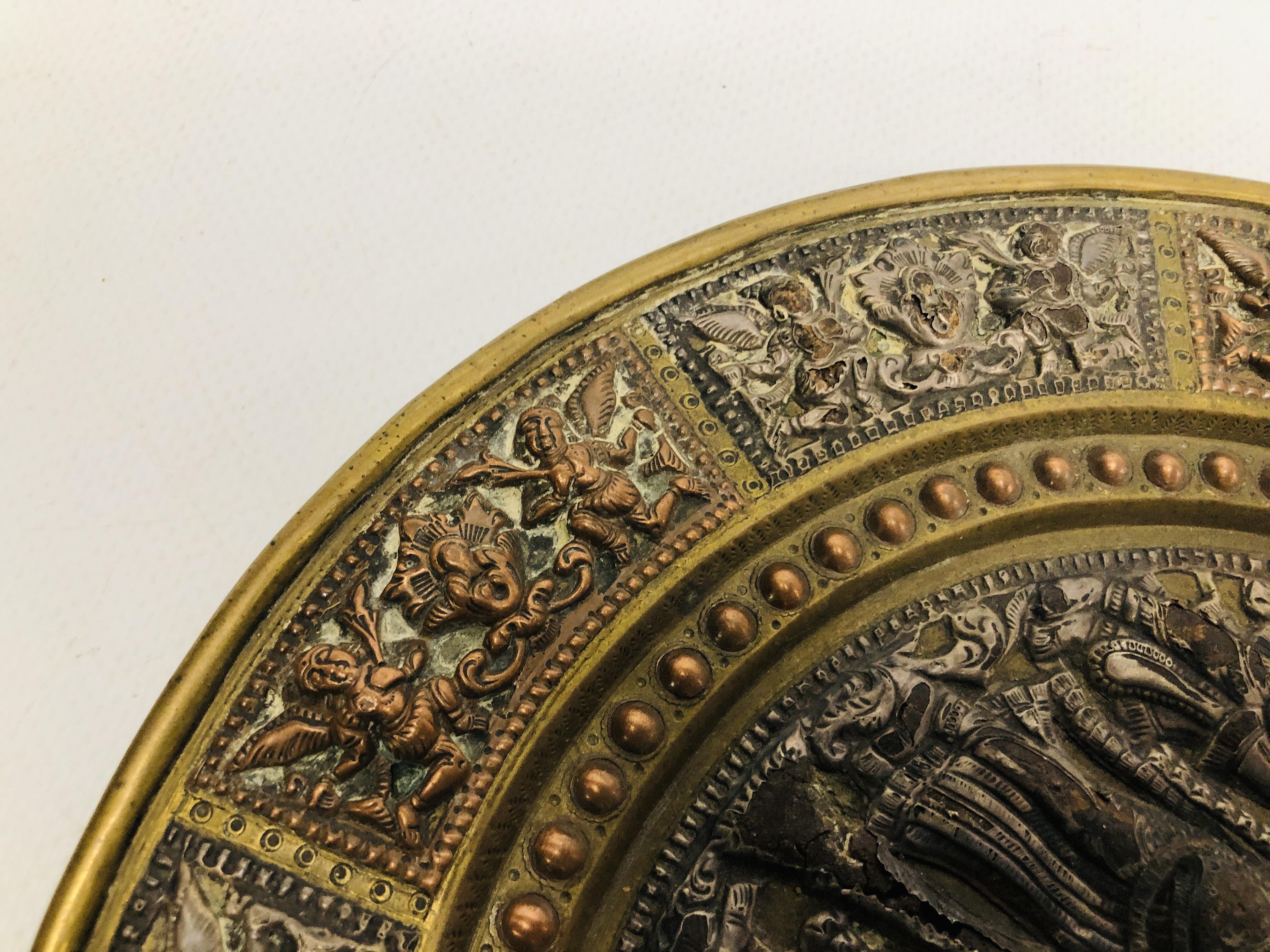 AN INDIAN BRASS AND COPPER MARRIAGE PLATE THE CENTRE WITH SILVERED FIGURES, - Image 9 of 11