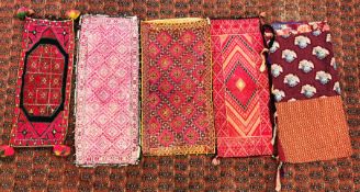 A GROUP OF FIVE VINTAGE MIDDLE EASTERN AND ASIAN STYLE CUSHION COVERS TO INCLUDE HAND CRAFTED