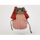 A TIBETAN SILK EMBROIDERED HEAD DRESS IN THE FORM OF A MYTHICAL CREATURE, H 38CM.