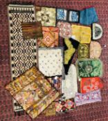 A BOX OF ASSORTED TEXTILES TO AN UZBEK BAG, EMBROIDERED TEA POT COVERS, HANGINGS AND COVERS ETC.