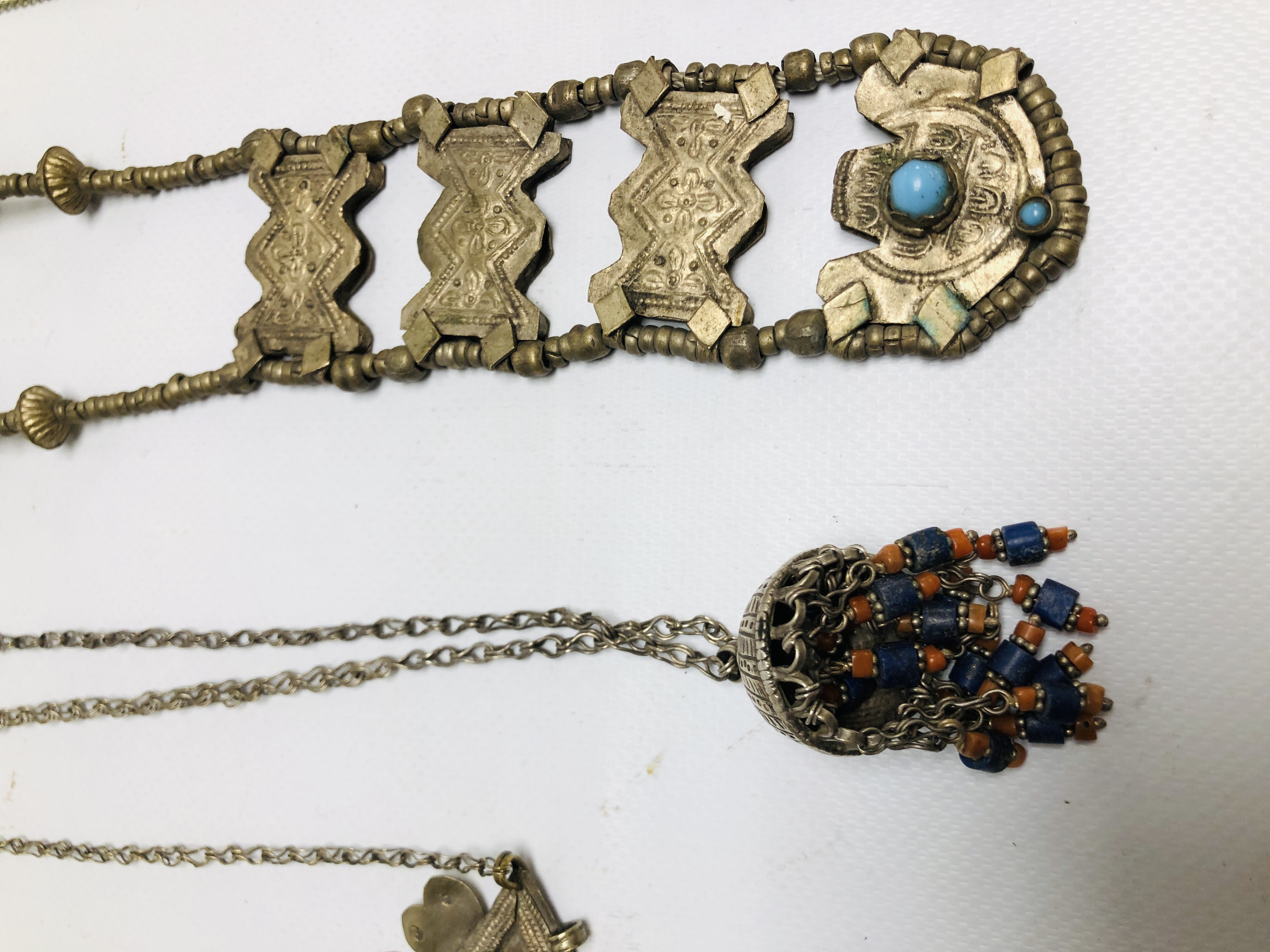 A GROUP OF 6 ASSORTED EASTERN STYLE WHITE METAL PENDANT NECKLACES TO INCLUDE STONE SET EXAMPLES. - Image 3 of 9