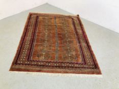 A HAND KNOTTED TURKOMAN RUG WITH CENTRAL BROWN FIELD, 70 INCH X 54 INCH.