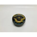 A VINTAGE ORIENTAL CLOISONNE CIRCULAR LIDDED BOX DECORATED WITH A DRAGON ON A BLACK BACKGROUND - D