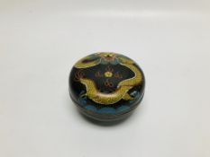 A VINTAGE ORIENTAL CLOISONNE CIRCULAR LIDDED BOX DECORATED WITH A DRAGON ON A BLACK BACKGROUND - D