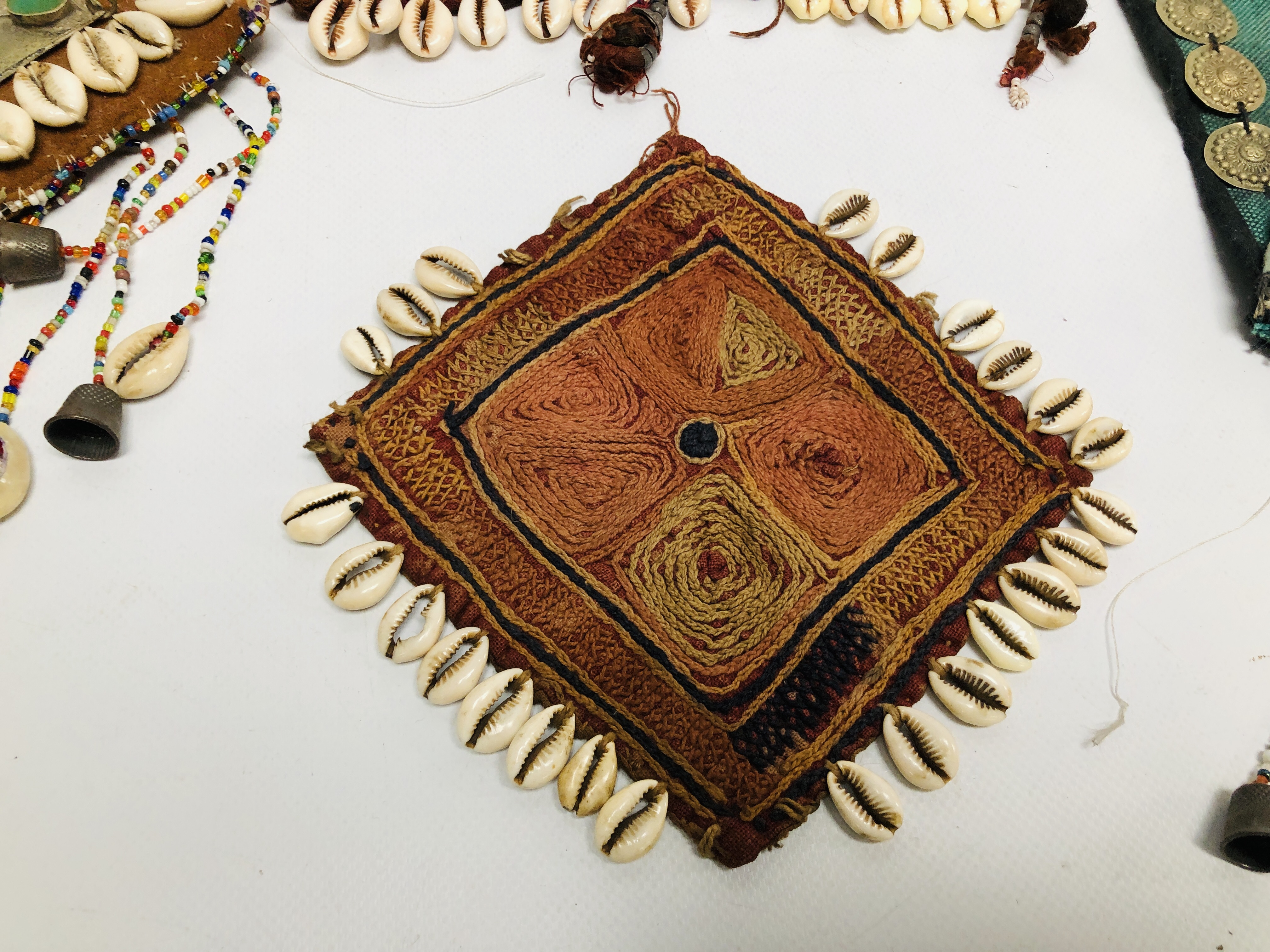 A GROUP OF FIVE VARIOUS AFGHAN TEXTILE PIECES APPLIED WITH COWRIE SHELLS AND OTHER DECORATION - Image 2 of 10