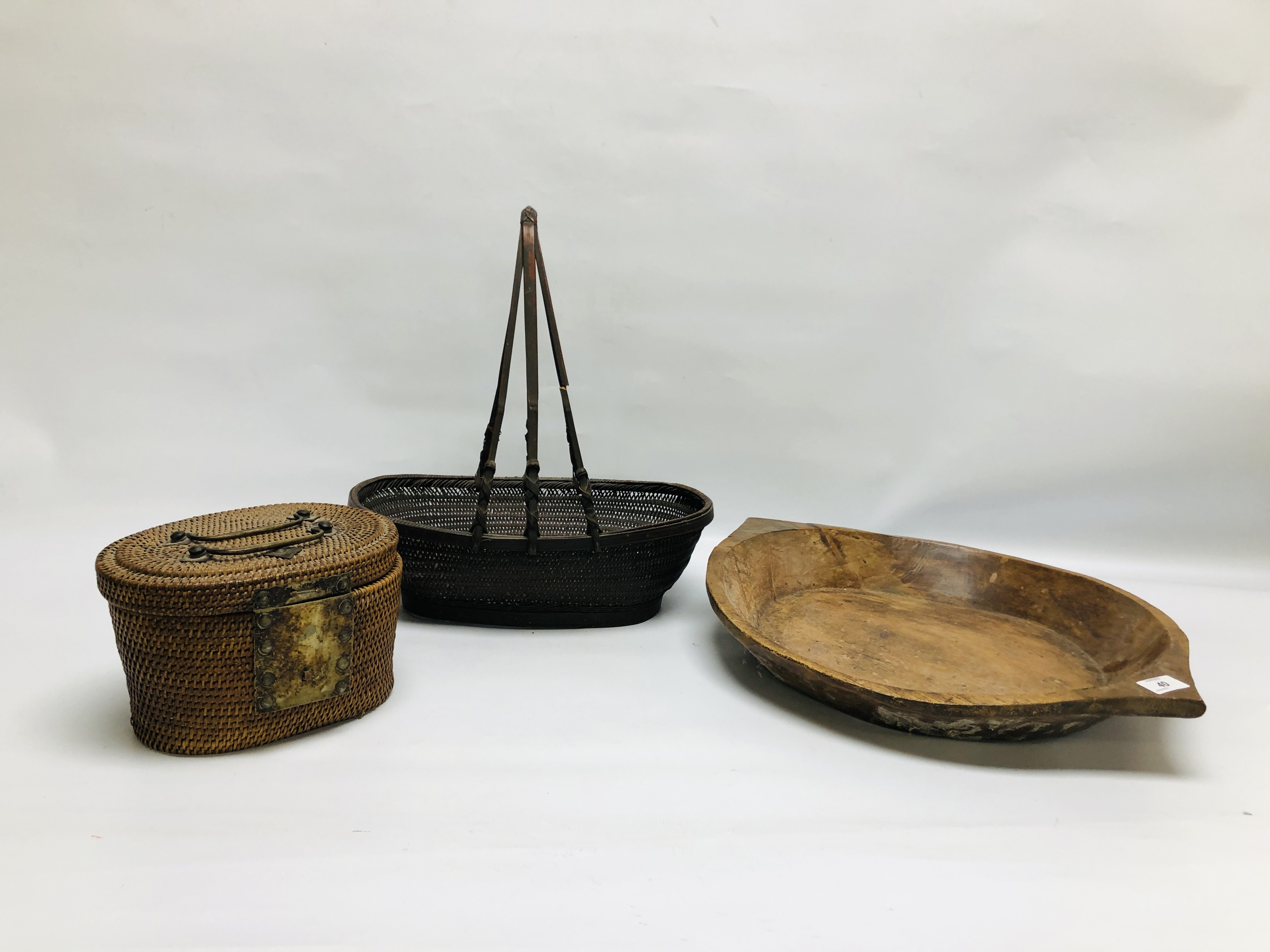 A VINTAGE WOVEN BAMBOO BASKET ALONG WITH A WOVEN WICKER TEA BASKET, METAL WORK HANDLES,