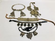 A GROUP OF 5 ELABORATE EASTERN STYLE WHITE METAL NECKLACES TO INCLUDE CHOKER EXAMPLES.