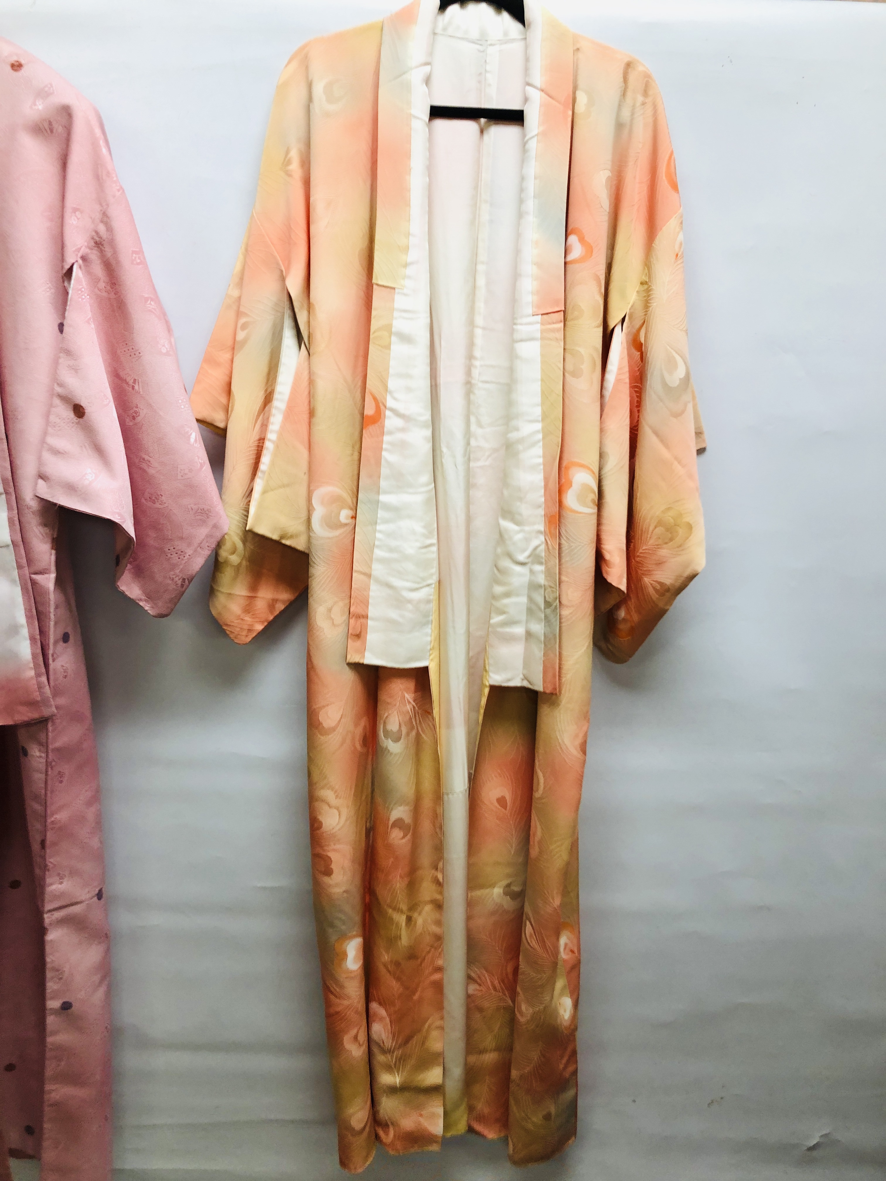 TWO MODERN JAPANESE SILK KIMONOS ONE ON A PASTEL PEACH FIELD HAVING A WOVEN PEACOCK FEATHER DESIGN - Image 2 of 7