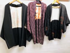 A GROUP OF THREE JAPANESE "HAORI" TO INCLUDE SILK EXAMPLES,