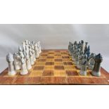 AN IMPRESSIVE LLADRO MEDIEVAL CHESS SET ALONG WITH A FITTED PINE CHESS BOARD BOX - W 76CM. X D 71CM.