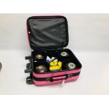 A SET OF 4 TAYLOR SIZE 1 LAWN BOWLS IN FITTED PINK TAYLOR TRAVEL CASE WITH ACCESSORIES